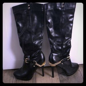 Black knee high boots with gold chain